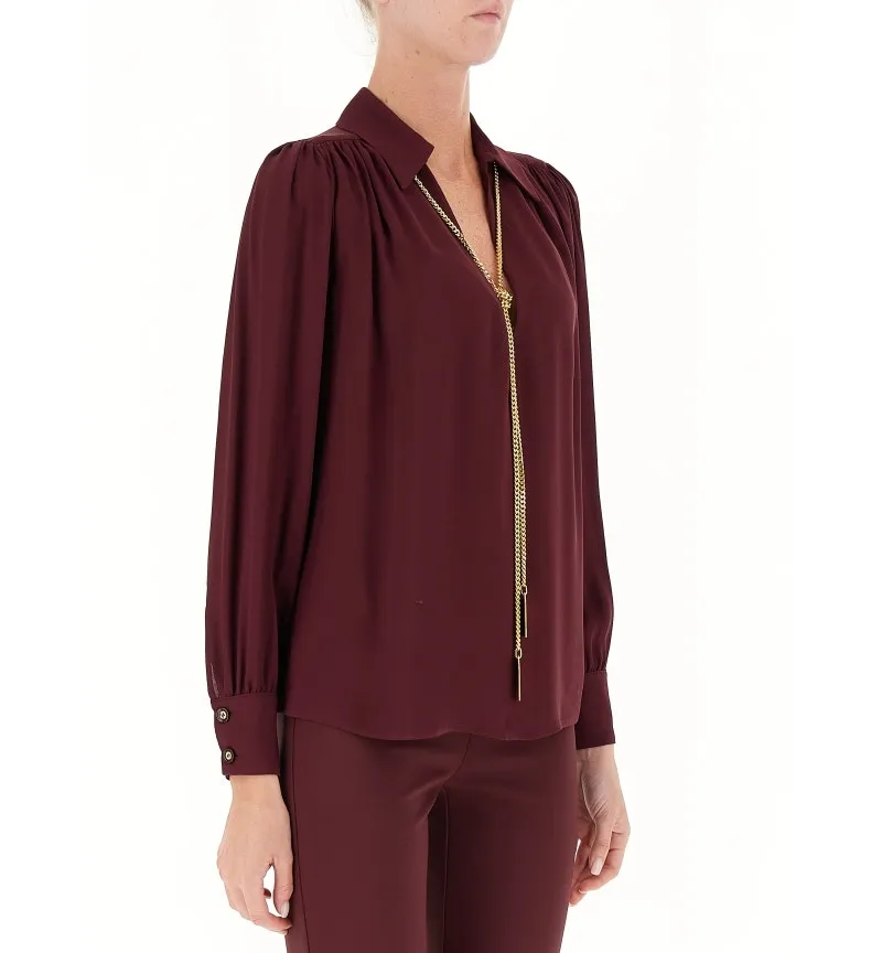 Blusa con collana