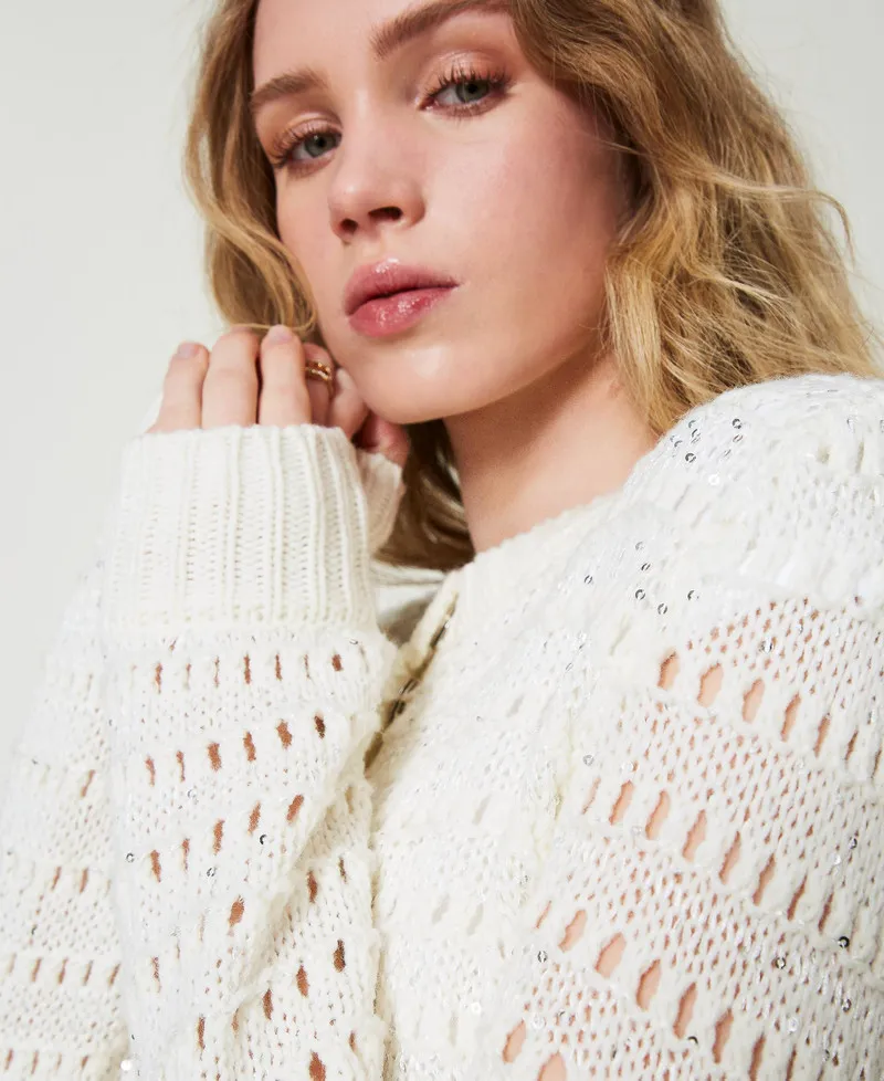 Cardigan traforato con paillettes