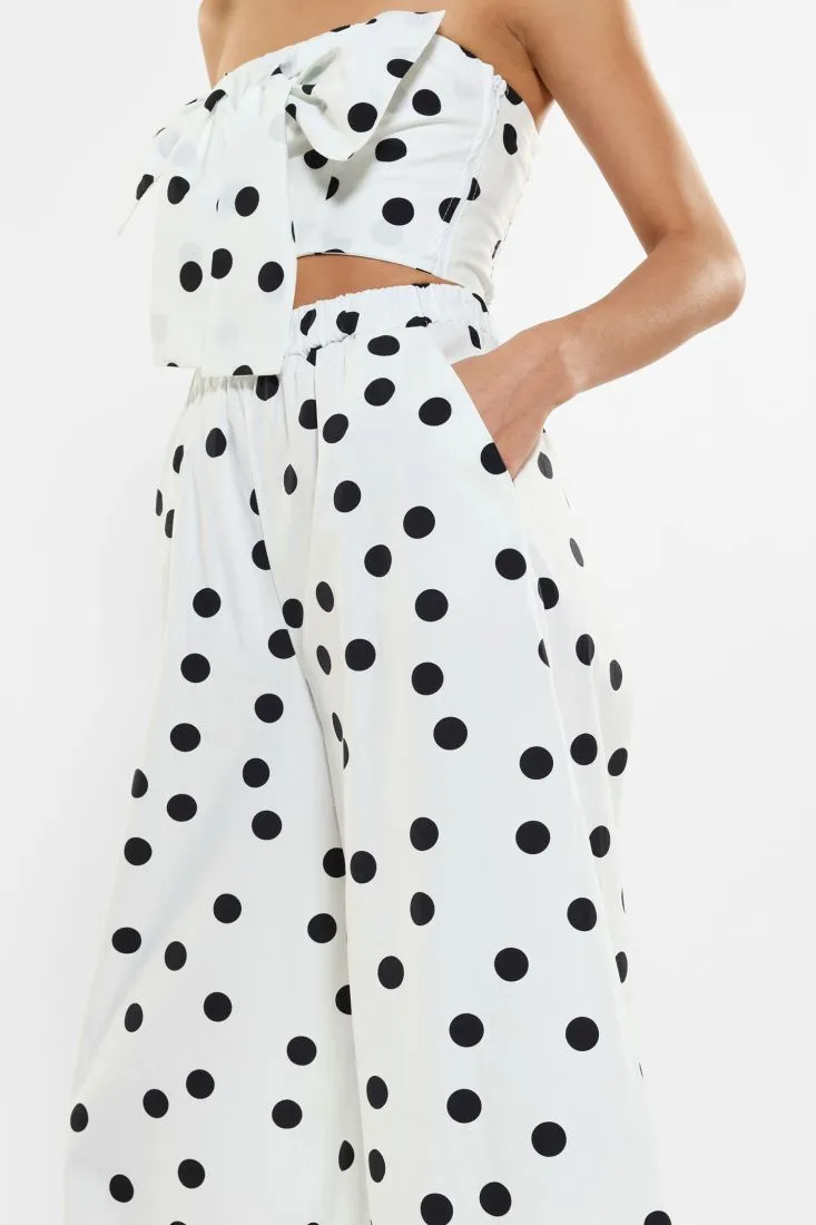 Pantaloni a palazzo fantasia a pois con pinces
