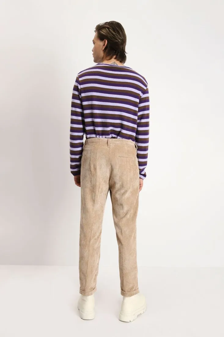 Pantaloni in velluto a costine con chiusura asimmetrica