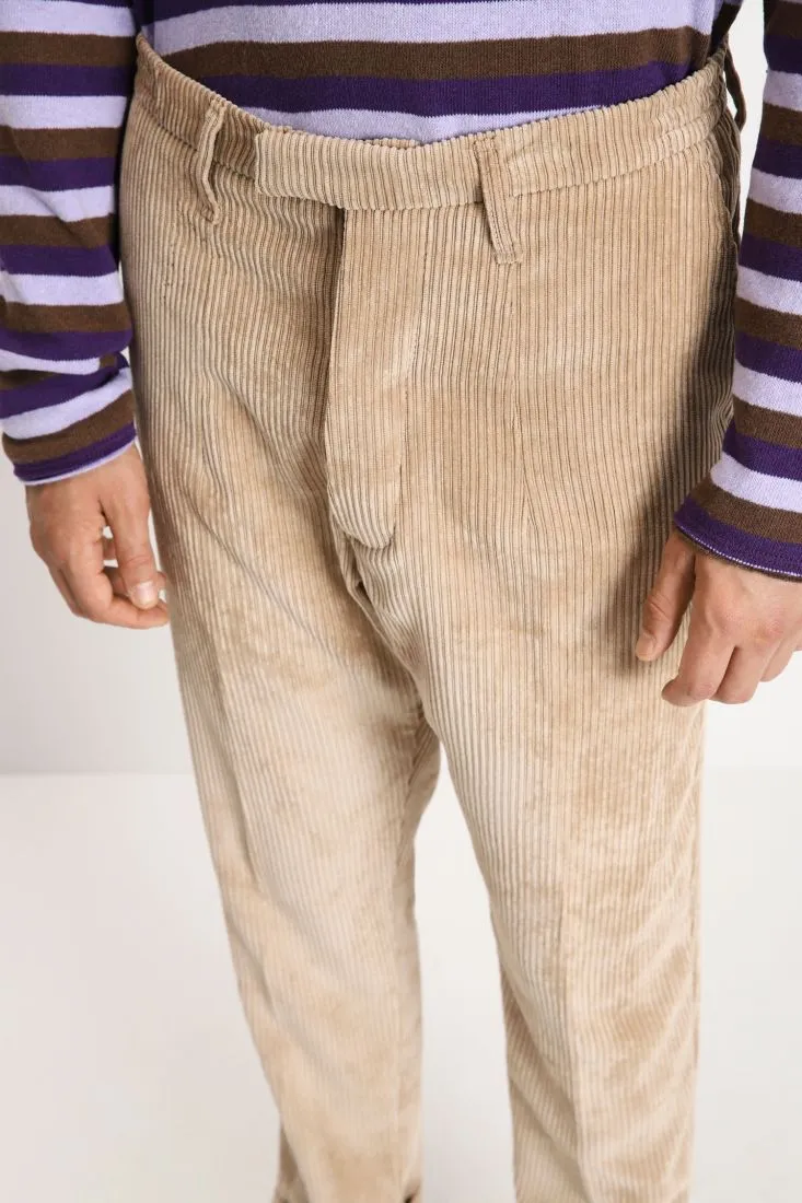 Pantaloni in velluto a costine con chiusura asimmetrica