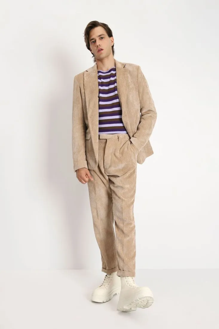 Pantaloni in velluto a costine con chiusura asimmetrica